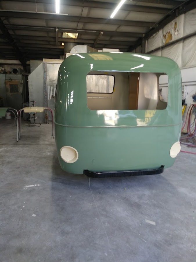Restored vintage camper at Premier Collision